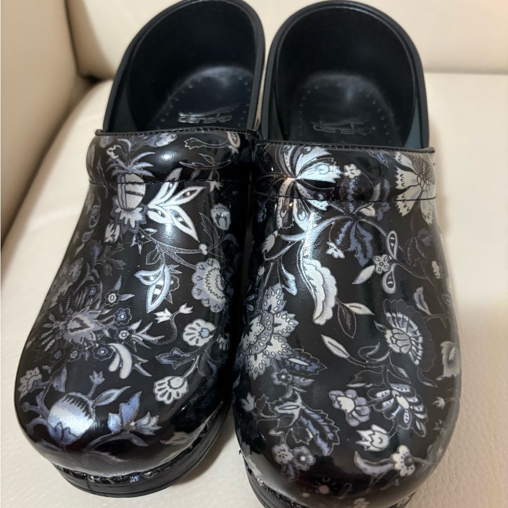 Dansko Black Floral Patent Clogs